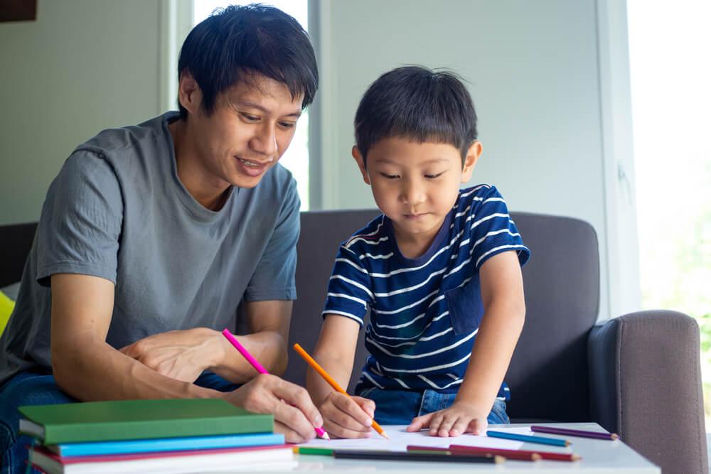 Parent helping child with homework in Singapore